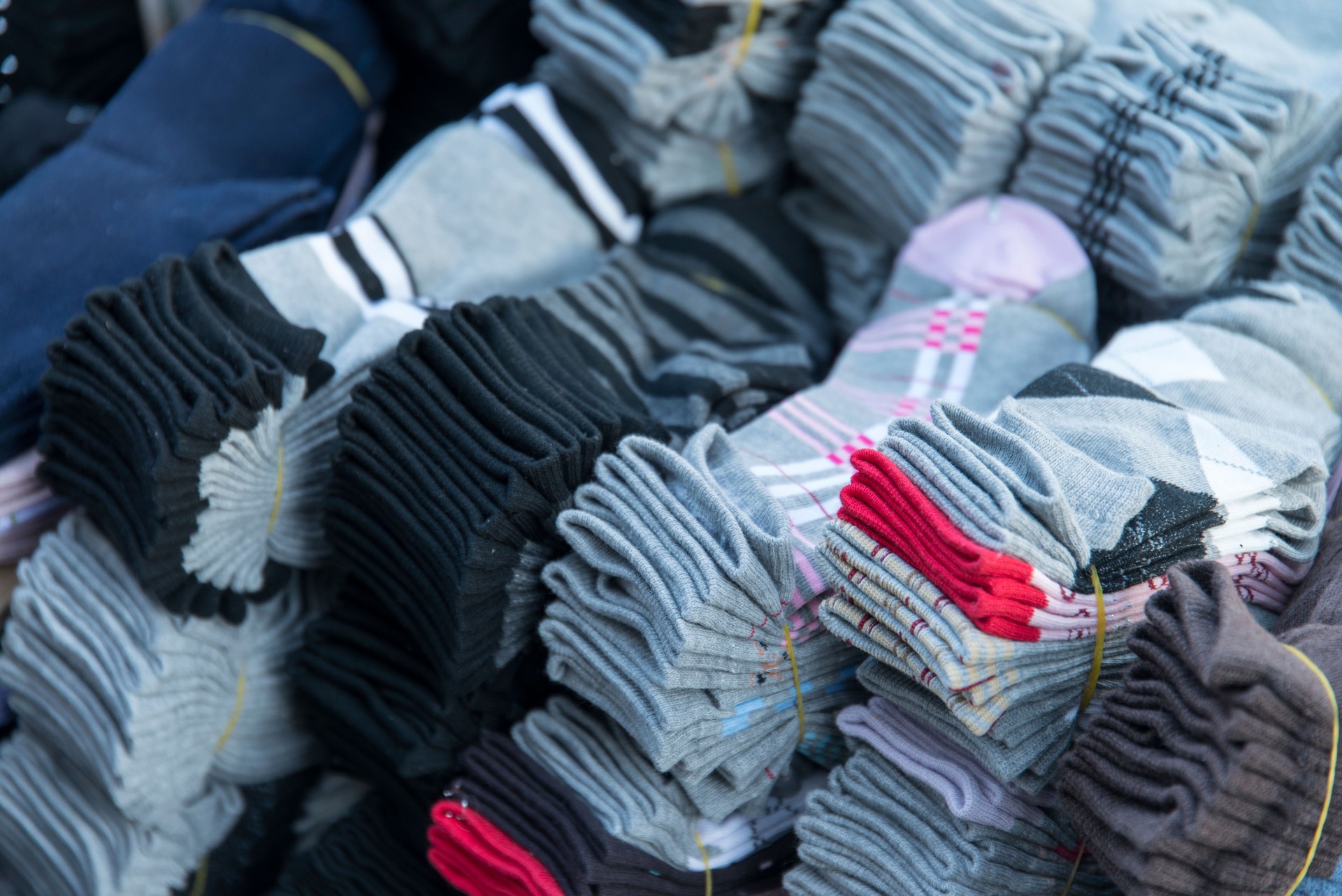 heap of various socks selling in the street
