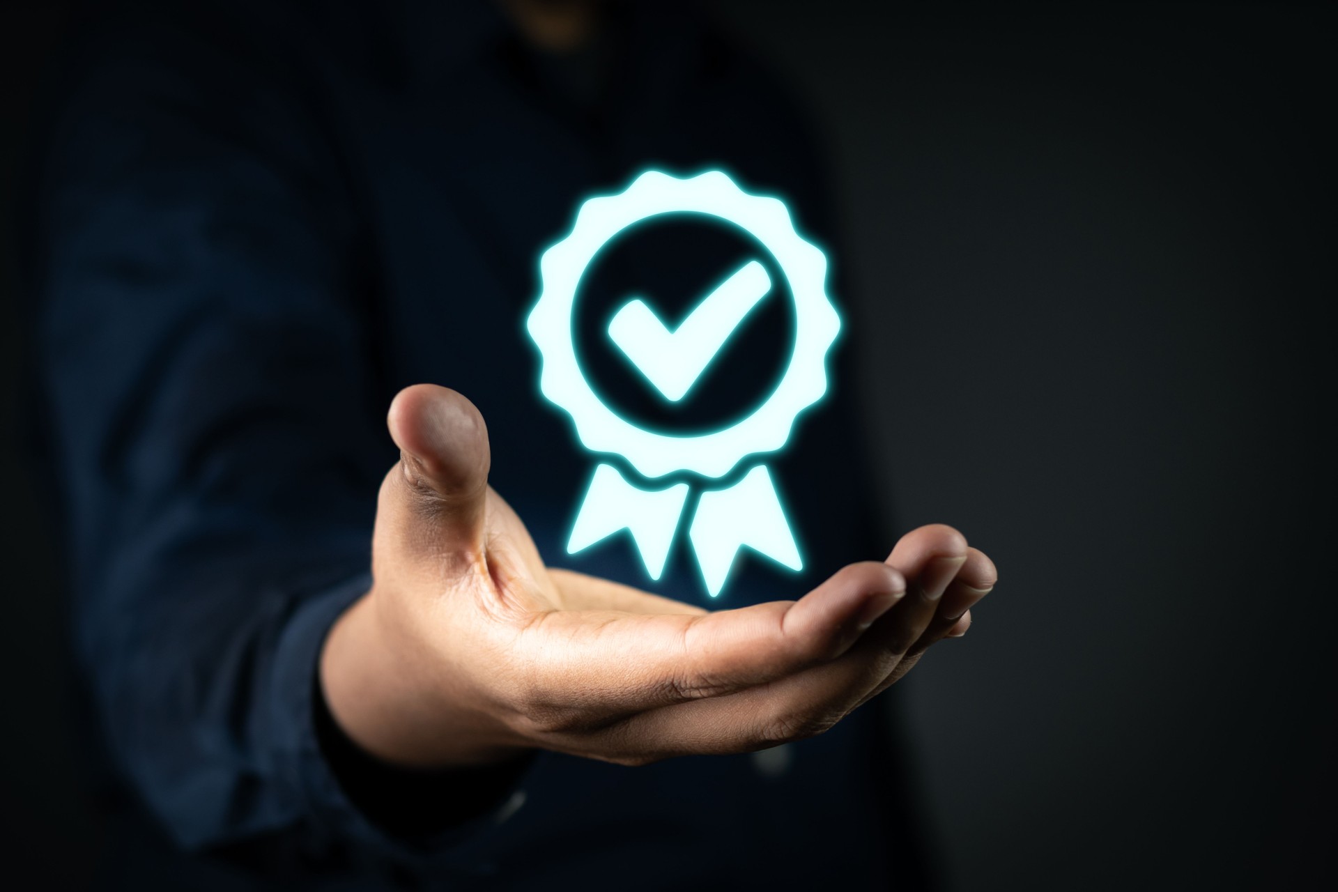 Quality Assurance Concept. Business people Hand with shows the sign of the top service Quality assurance,good service,premium service assurance,excellence service,high quality,guarantee.